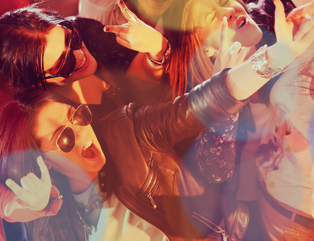 Group Of Young People Having Fun Dancing At Party